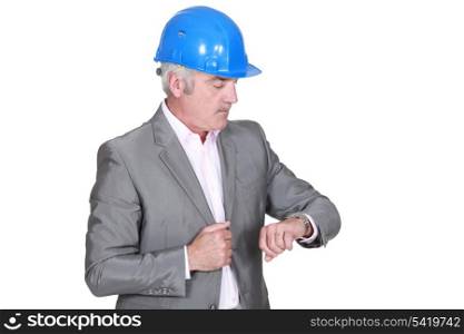 Senior architect checking his watch