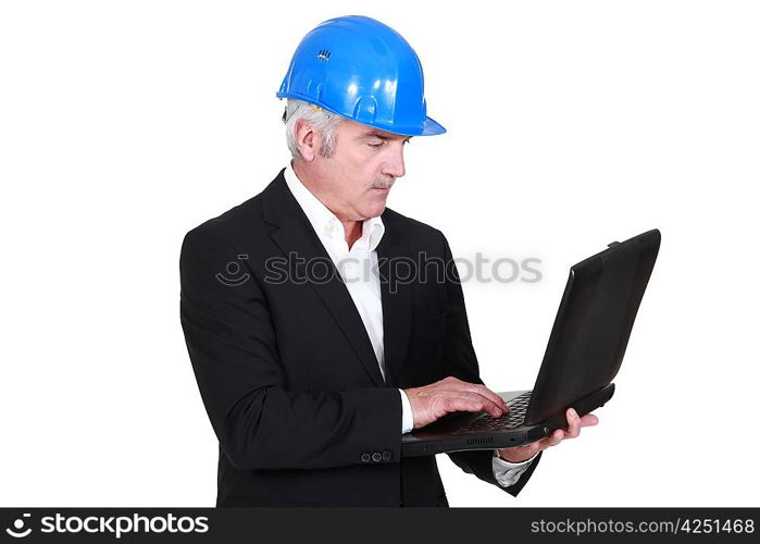 Senior architect with computer in hand