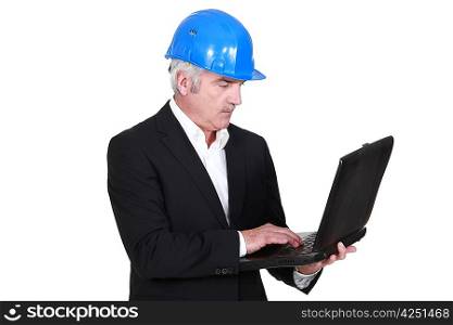 Senior architect with computer in hand