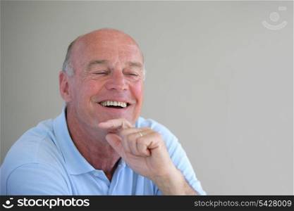 Senior bald man laughing