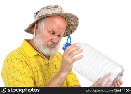 senior balding bearded man holding empty plastic bottle. senior man looking into empty bottle