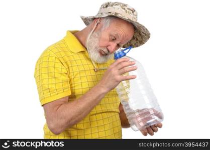 senior bearded man looks into empty plastic bottle