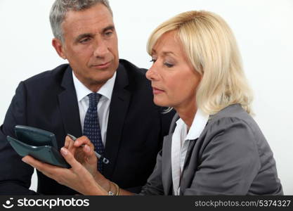 Senior business couple going over finances