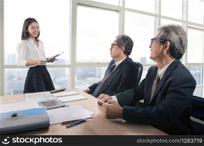 senior business man and young woman in office meeting room