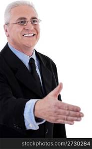Senior business man holding out his hand for a handshake over white background