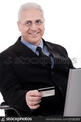 Senior business man making online purchase with his credit card on white background