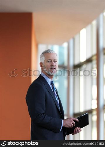 senior business man working on tablet computer at office