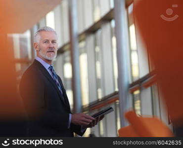 senior business man working on tablet computer at office