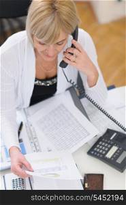 Senior business woman making phone call. Top view
