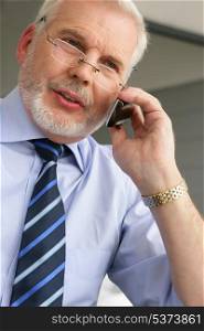Senior businessman on the phone