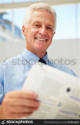 Senior businessman reading document