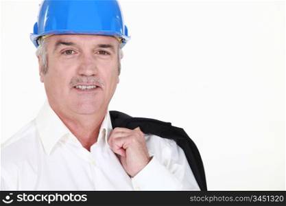 senior businessman wearing helmet and smiling