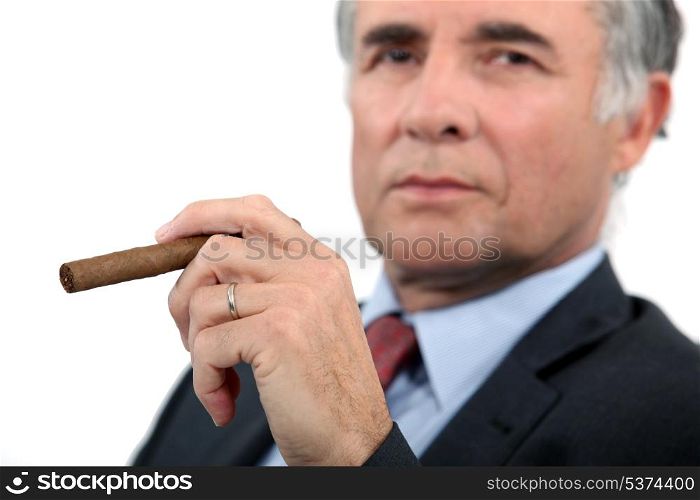 Senior businessman with cigar