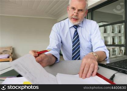 senior businessman working at his desk