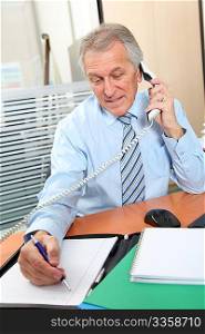Senior businessman working in the office