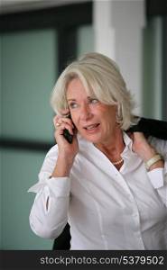 Senior businesswoman on the phone