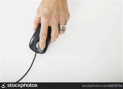 Senior businesswoman&rsquo;s hand using computer mouse