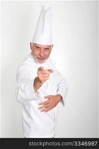 Senior chef pointing at camera