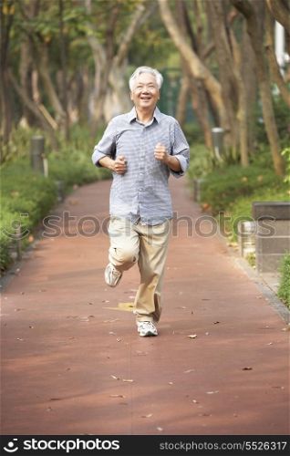 Senior Chinese Man Jogging In Park