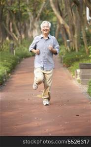 Senior Chinese Man Jogging In Park