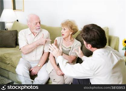 Senior couple arguing in a counseling session. Copyspace for text.