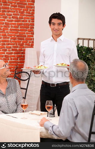 Senior couple dining in restaurant