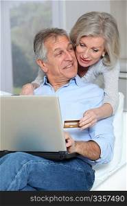 Senior couple doing online shopping