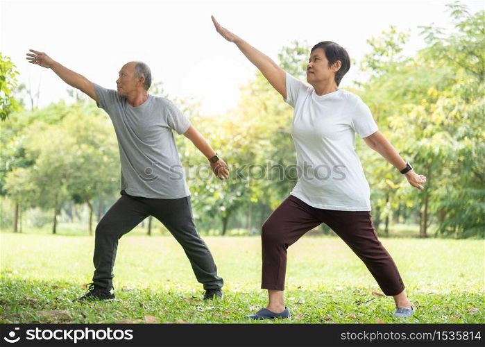 Senior couple doing stretching exercise at park. Old man and woman workout at nature outdoor. Fitness and Wellness, healthy lifestyle.