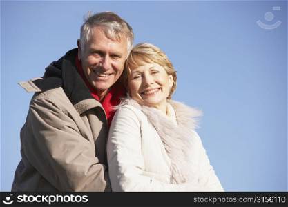 Senior Couple Embracing In Park
