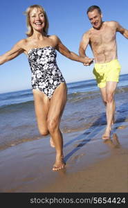 Senior Couple Enjoying Beach Holiday