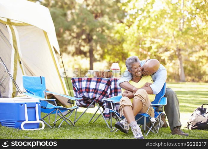 Senior Couple Enjoying Camping Holiday In Countryside
