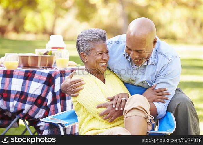 Senior Couple Enjoying Camping Holiday In Countryside