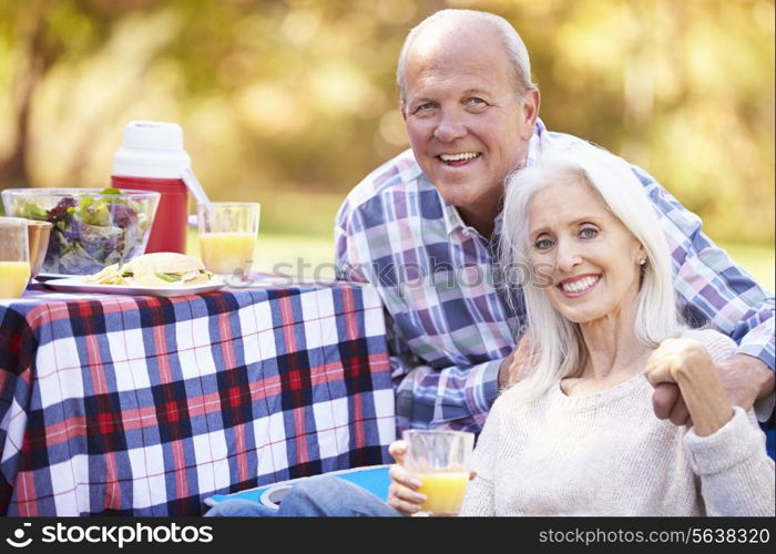 Senior Couple Enjoying Camping Holiday In Countryside