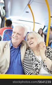 Senior Couple Enjoying Journey On Bus