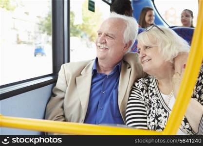 Senior Couple Enjoying Journey On Bus