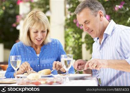 Senior Couple Enjoying Meal outdoorss