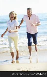 Senior Couple Enjoying Romantic Beach Holiday