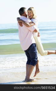 Senior Couple Enjoying Romantic Beach Holiday