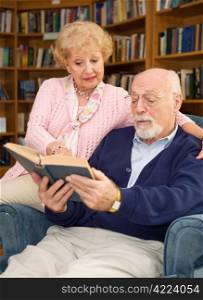 Senior couple enjoys reading a good book together.