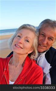 Senior couple exercising by the sea