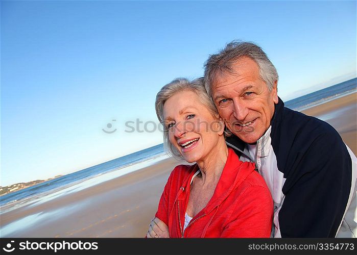 Senior couple exercising by the sea
