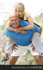 Senior Couple Exercising In Park