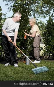 Senior couple gardening together