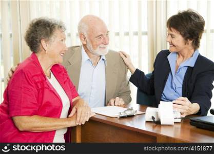 Senior couple gets good news from their accounant.