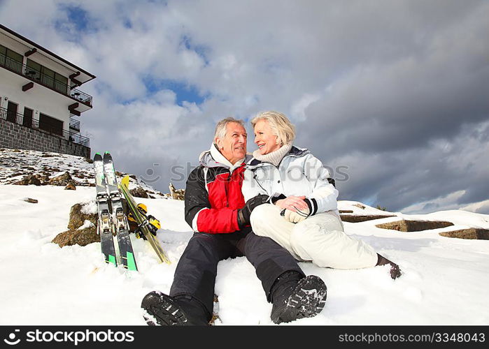 Senior couple having fun at ski resort