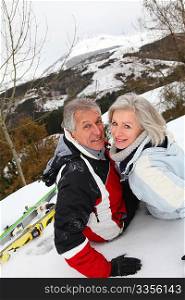 Senior couple having fun at ski resort