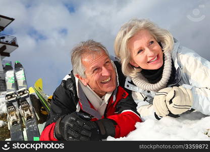 Senior couple having fun at ski resort