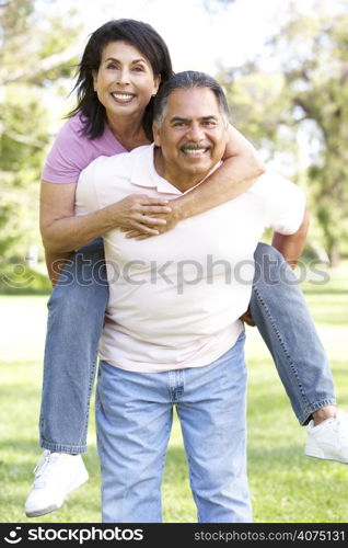 Senior Couple Having Fun In Park