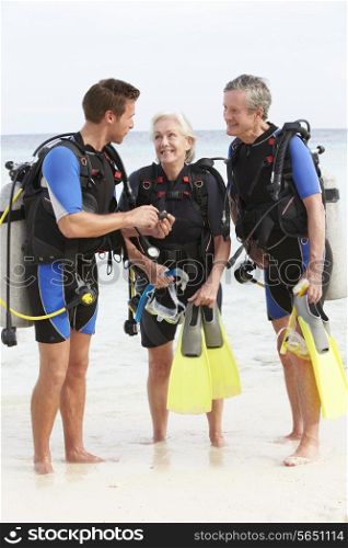 Senior Couple Having Scuba Diving Lesson With Instructor