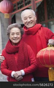 Senior Couple Holding Chinese Lantern